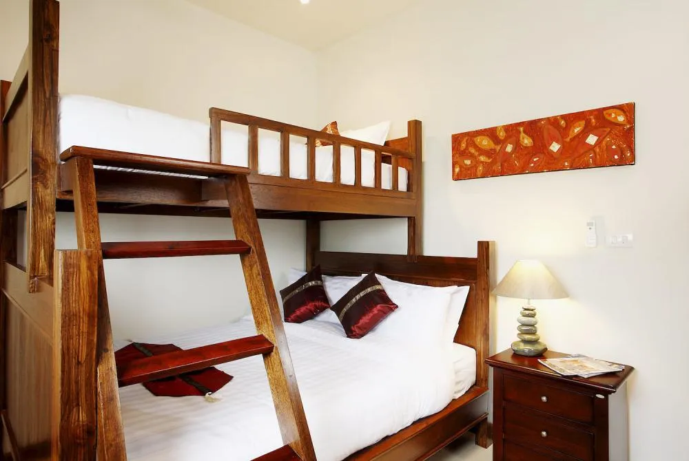 Spacious 2nd bedroom with queen size bed with single bed above, sleeping three guests