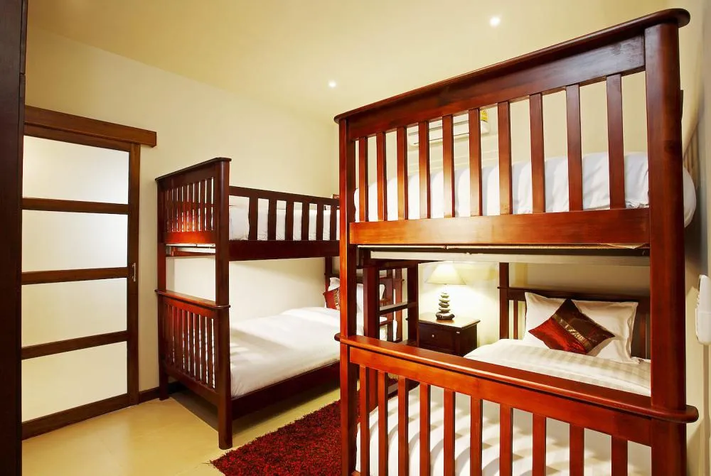 Bedroom 6, with 4 single beds, allows the villa to accommodate 16 guests in total