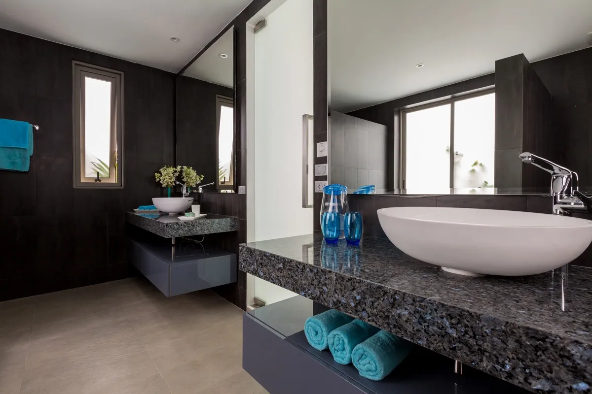 Ensuite Bathroom featuring "his and hers" sinks